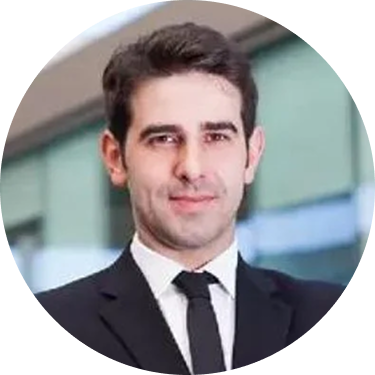 A smiling man with dark hair